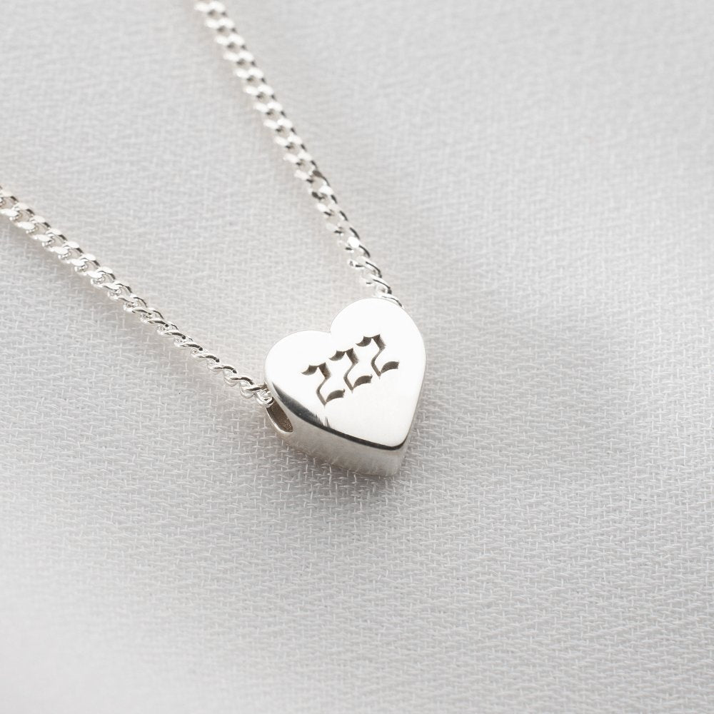 Custom heart locket necklace, perfect for gifting to someone special.