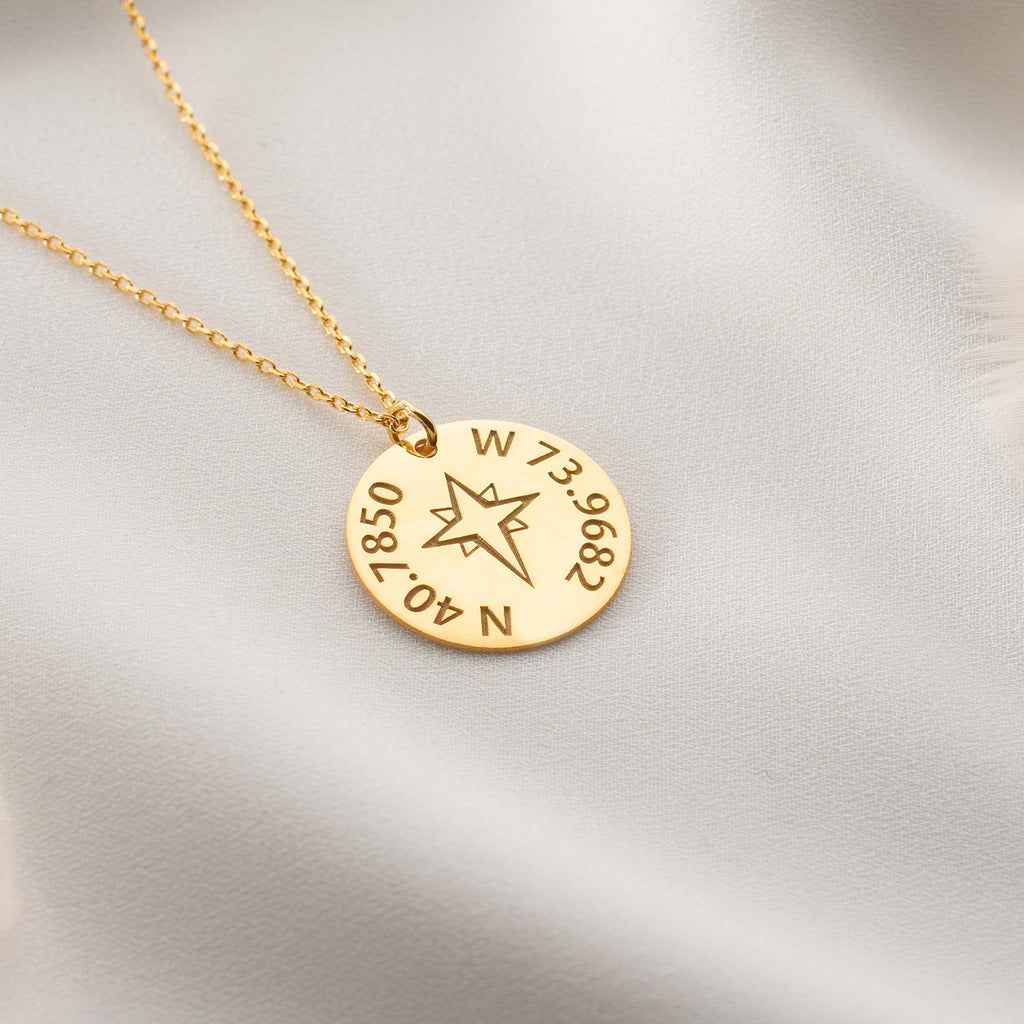 Custom latitude and longitude necklace with compass charm, perfect for travel lovers.