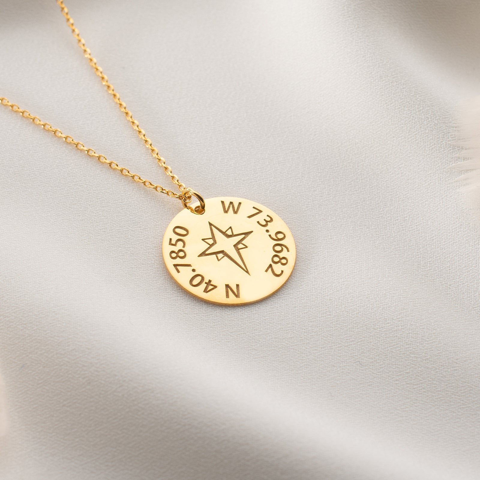 Custom latitude and longitude necklace with compass charm, perfect for travel lovers.