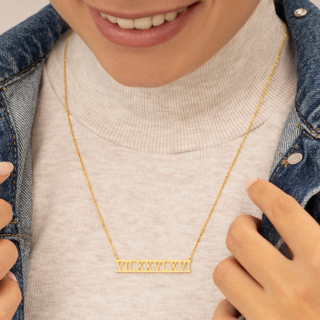 Engraved date necklace featuring personalized year, a unique and meaningful gift.