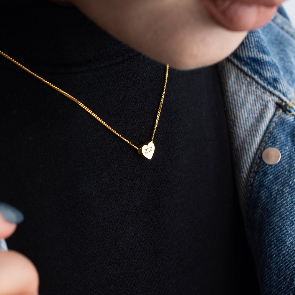 Heart pendant necklace with curb chain, a trendy and timeless jewelry item.