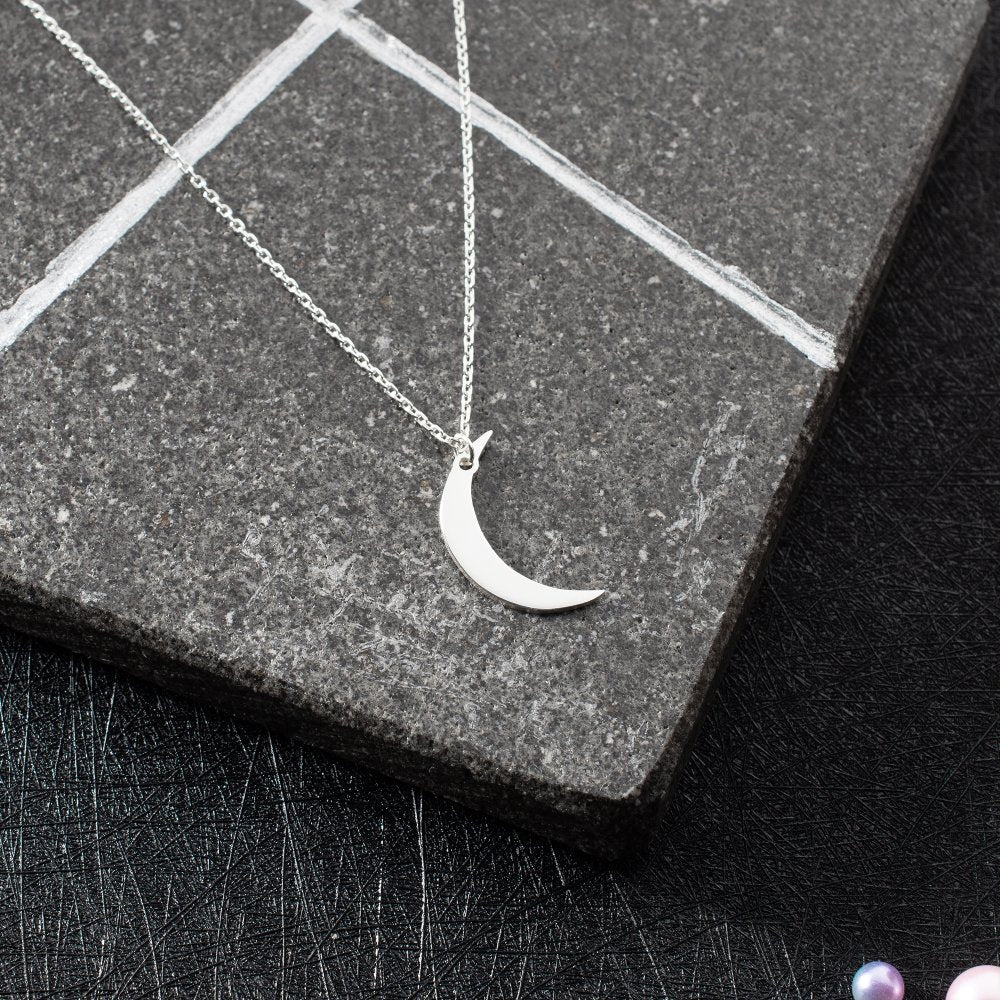 Minimalist moon pendant necklace, an elegant gift for moon lovers and stargazers.