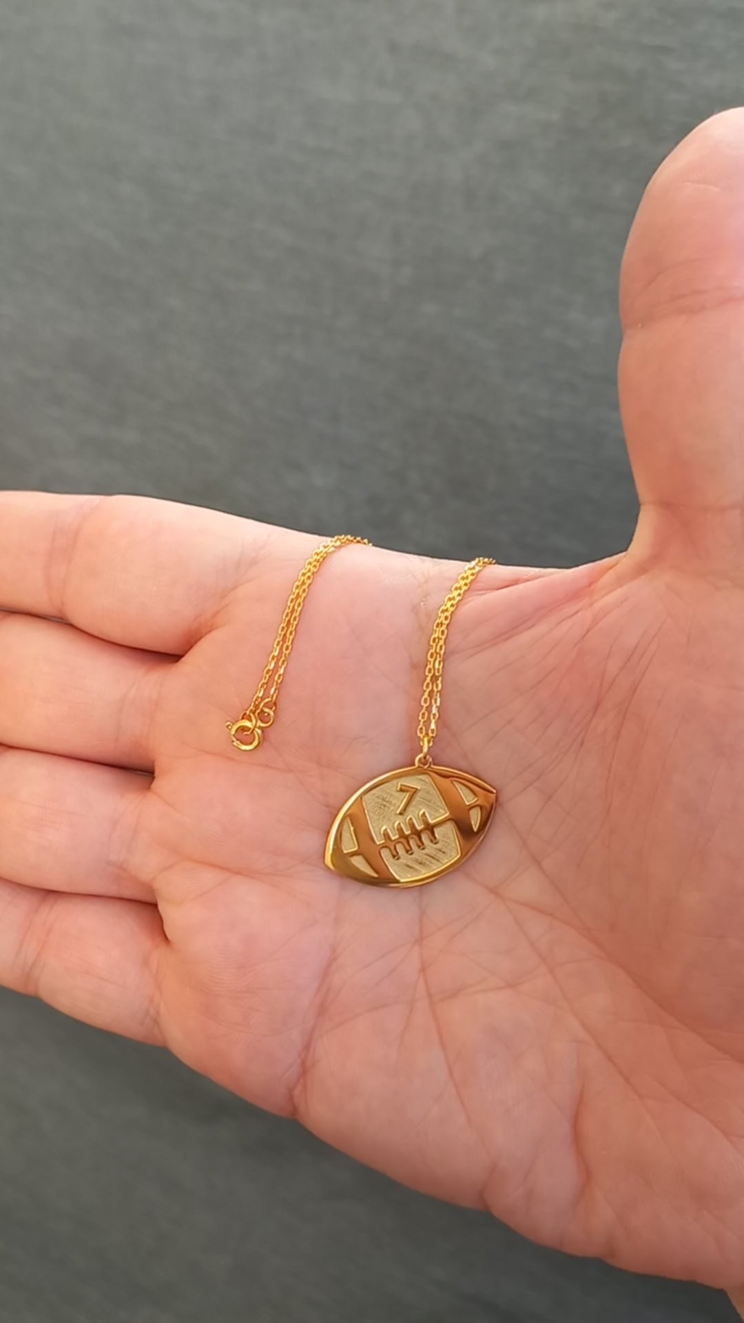 Custom football pendant, a meaningful jewelry gift for football lovers.
