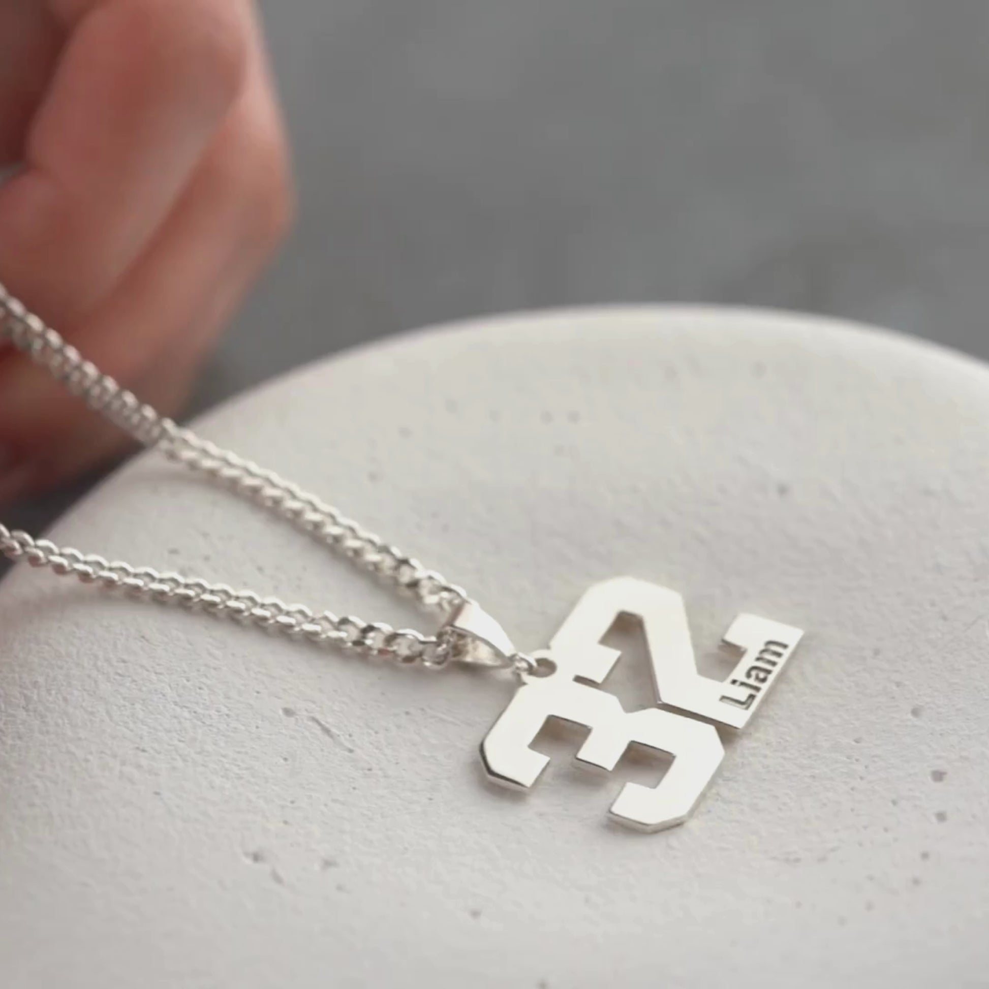 Personalized number pendant for athletes, perfect for baseball or hockey
